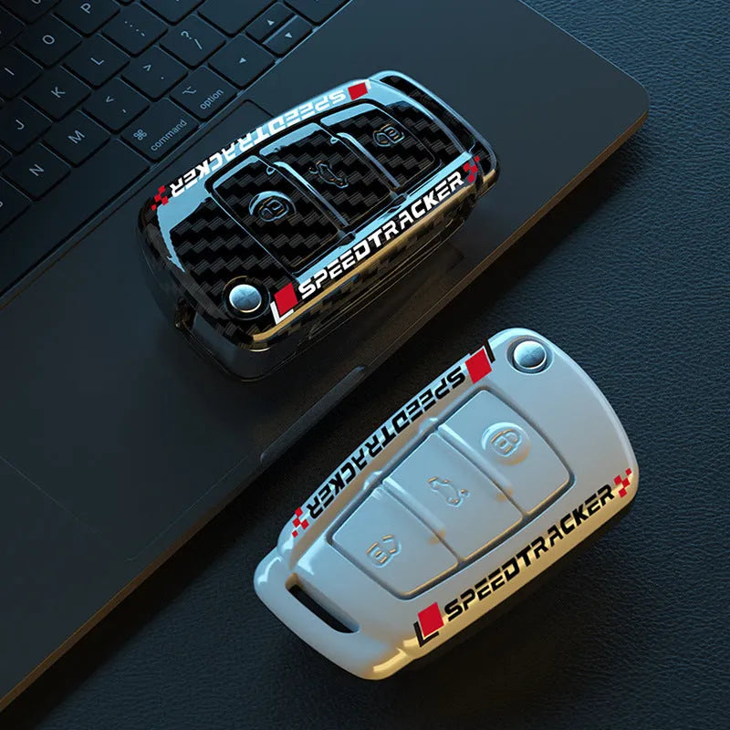 Carbon fibre pattern car key cover with mirrored surface elements in carbon black colour