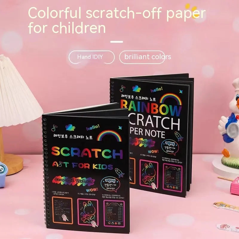 Large sheet of black scratch art paper for children, with a colourful revealed pattern showing through scraped areas.