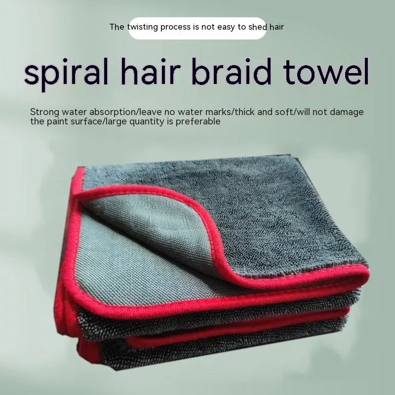 Grey car cleaning towel with black edge trim showing hemmed sides and spiral hair texture.