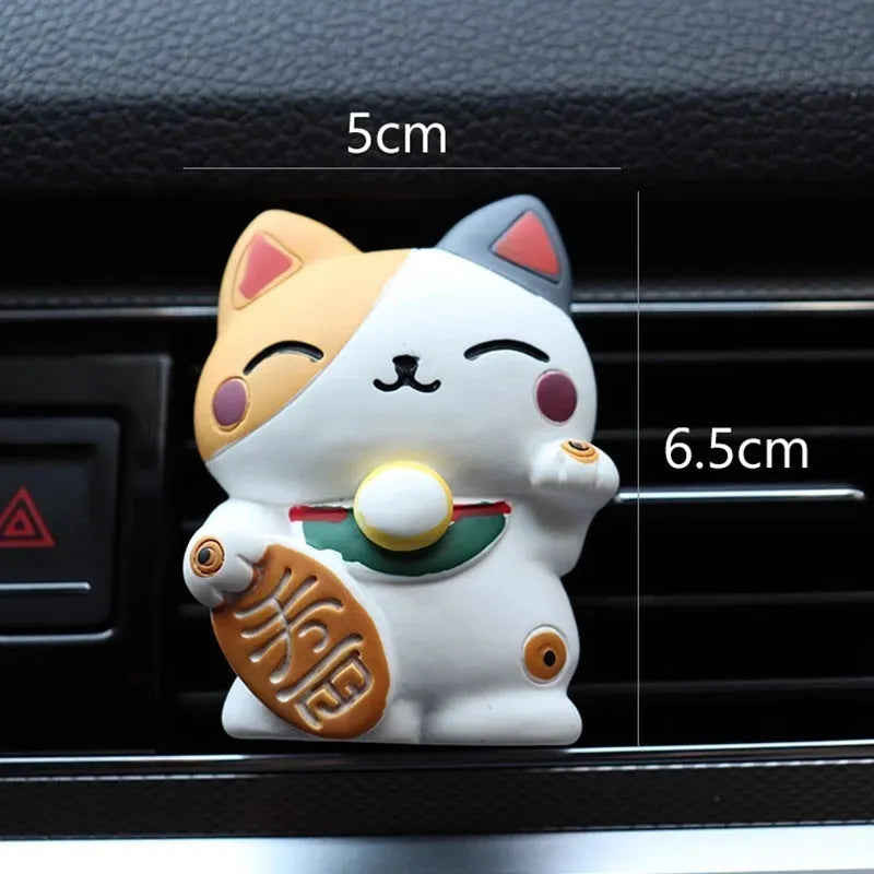 Resin fortune cat car vent aromatherapy clip in black or white.
