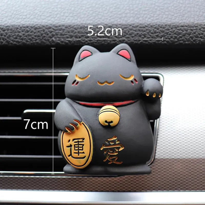 Resin fortune cat car vent aromatherapy clip in black or white.