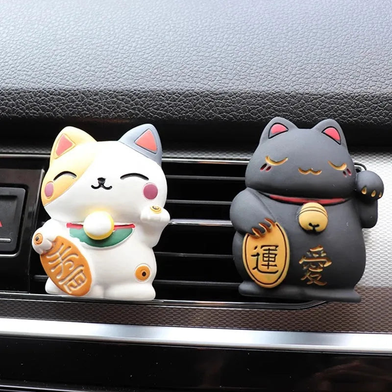 Resin fortune cat car vent aromatherapy clip in black or white.