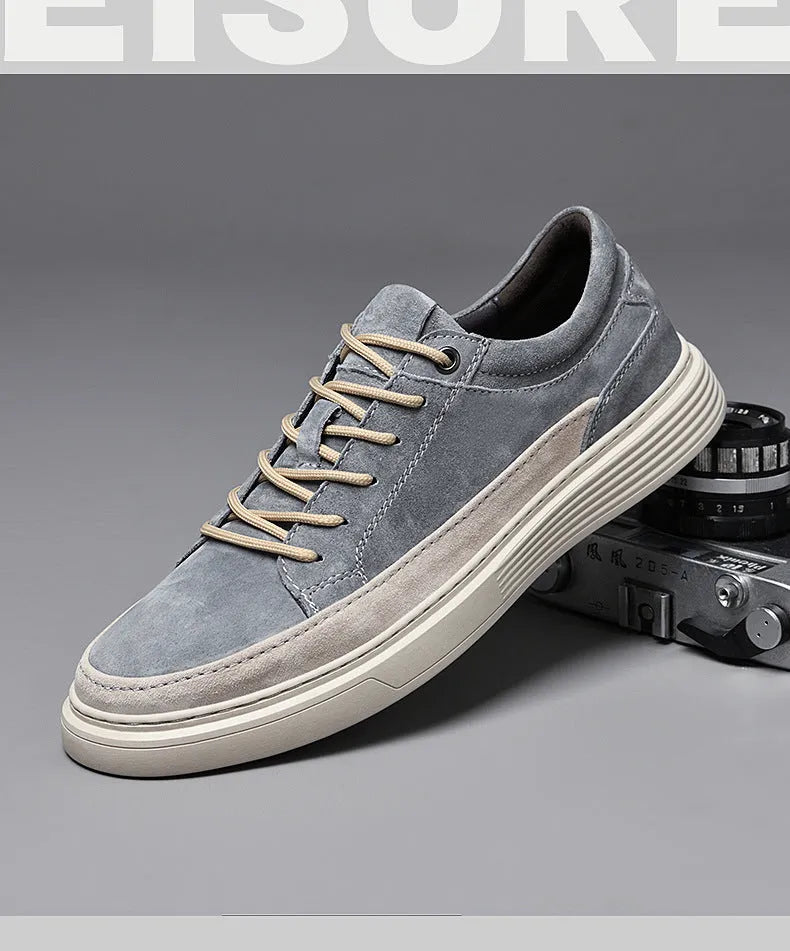 Men's grey pigskin leather casual skate shoes with a flat rubber sole and lace-up front.