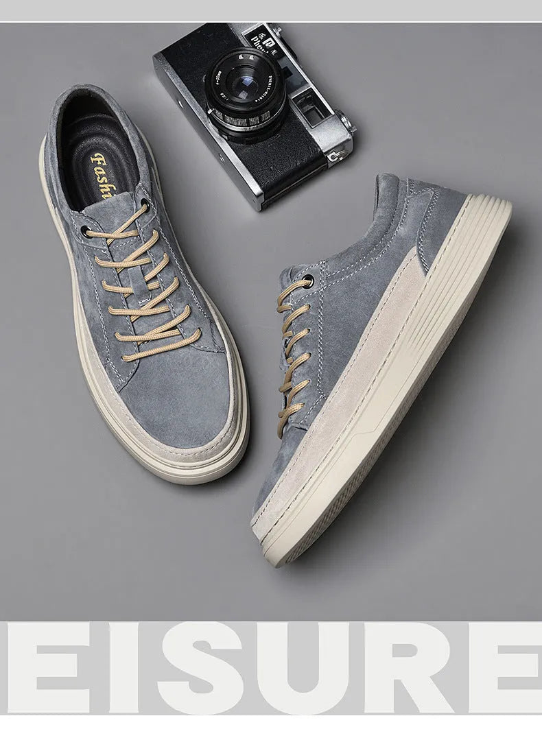 Men's grey pigskin leather casual skate shoes with a flat rubber sole and lace-up front.