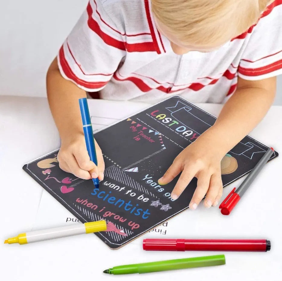 Wooden blackboard with first day of school design on density plate measuring 25.5 by 30 centimetres