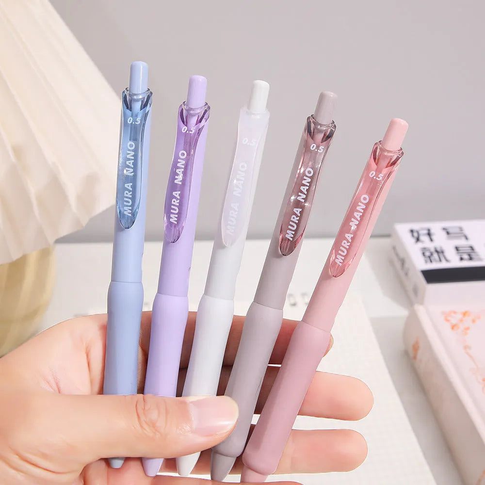 Macaron colour press gel pen with 0.5mm tip shown in smoked brown, smoked powder and smoked white refill options