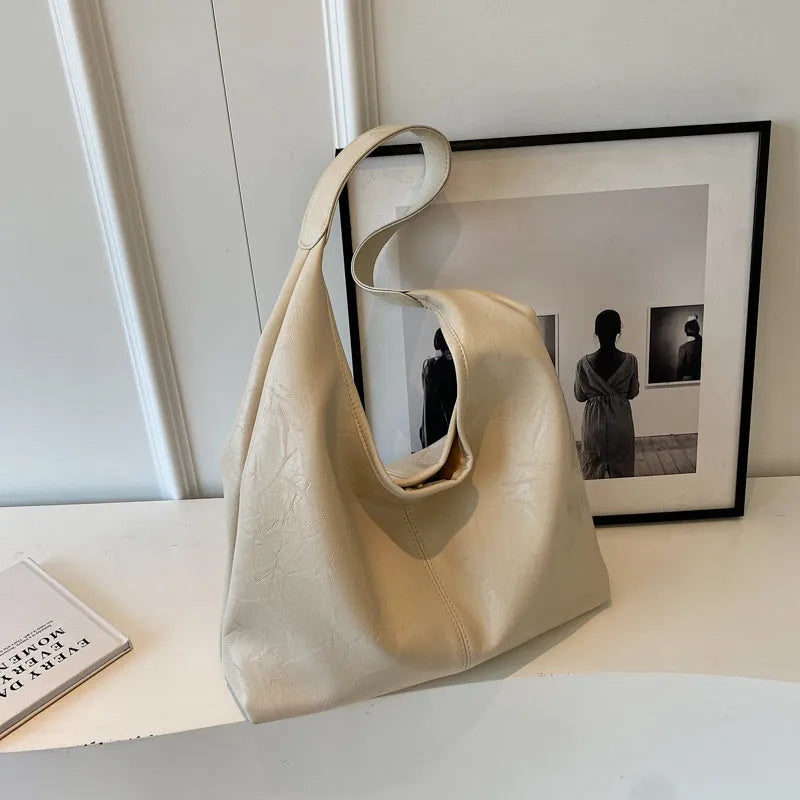 Soft leather casual shoulder bag with sandwich pocket design and large storage capacity