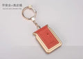 Bluetooth dual SIM adapter keychain for iOS devices in black leather colour with NANO SIM slots
