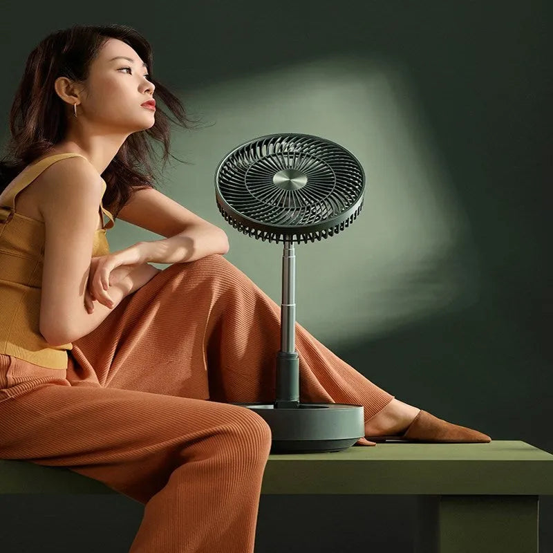 Green and white storage floor electric fan with telescopic design showing desktop and vertical configurations