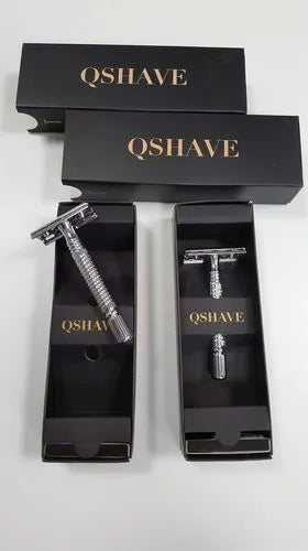 Chrome-plated brass double edged safety razor with blade and storage box.