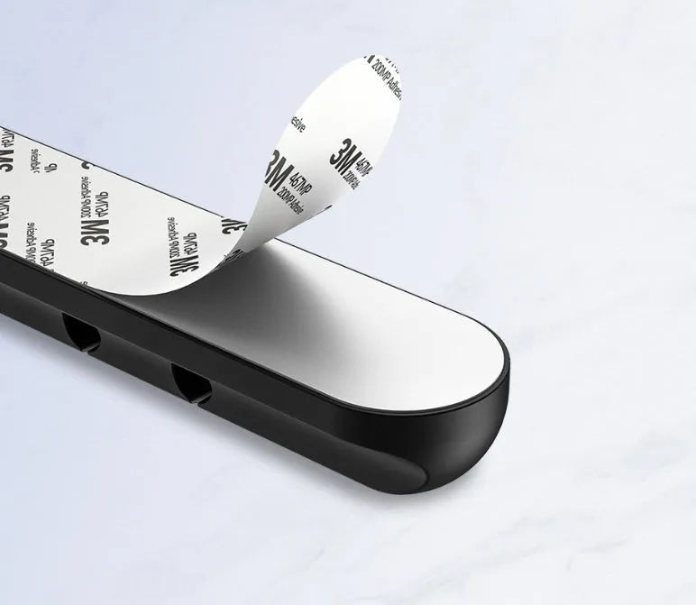 Black silicone desktop cable manager clips with strong double-sided glue for USB cables and wired headphones