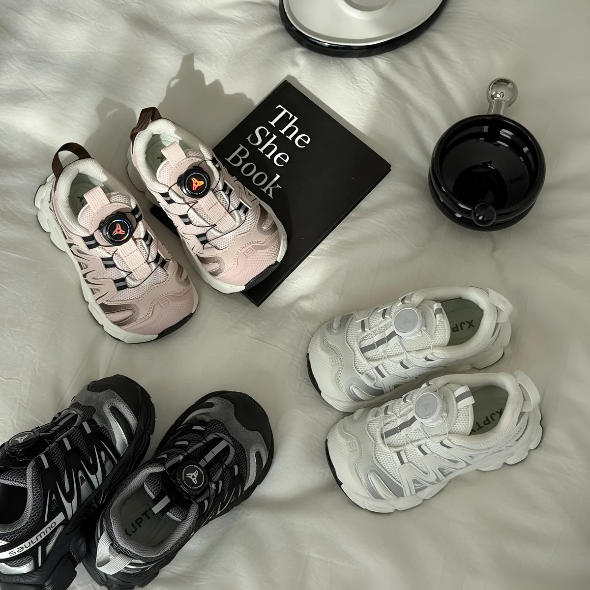 Pair of lightweight casual shoes with a solid-colour breathable mesh upper, shown in beige.