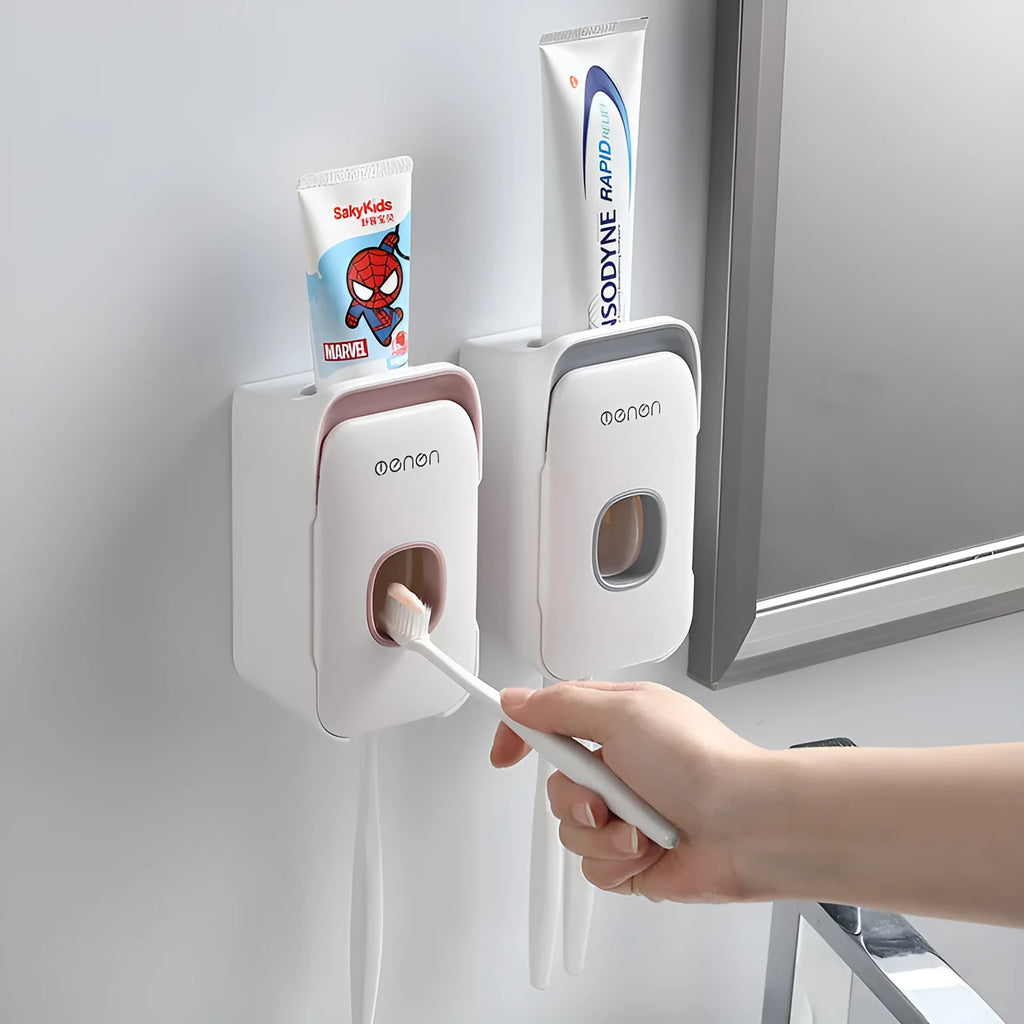 Automatic touchless toothpaste dispenser with digital LCD display mounted on a bathroom wall