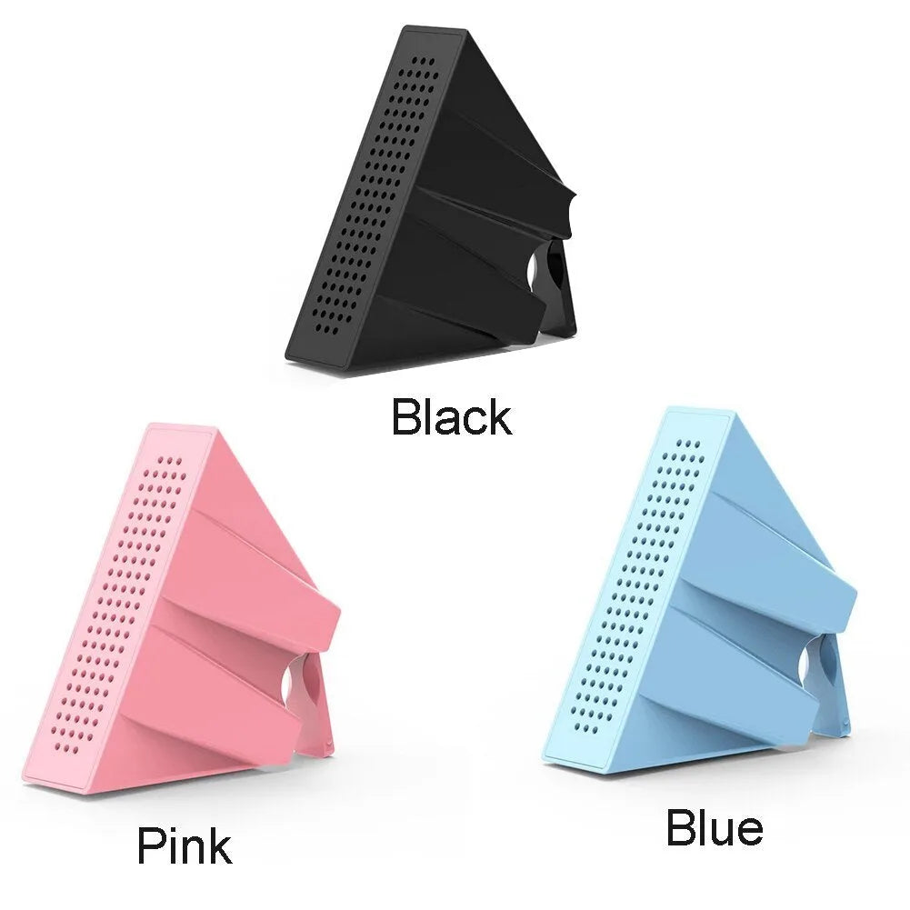 Mini black ABS mobile phone amplifier bracket holding an iPhone on a desktop.