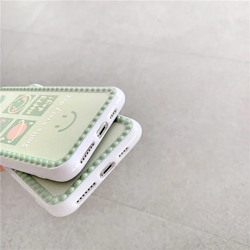 Green TPU iPhone case with geometric smiley face design, shown in polka dot frame and square grid styles.