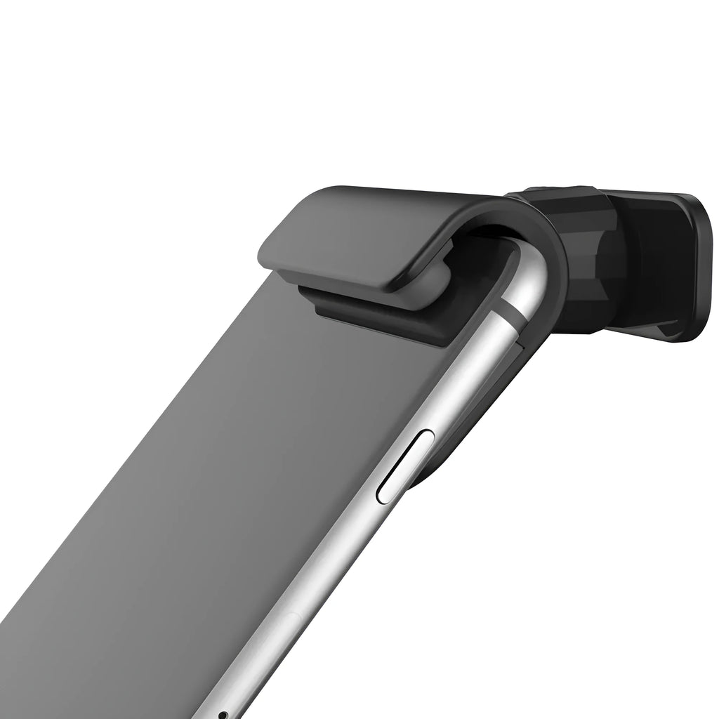 Black gravity car phone holder with 360-degree rotation on a car dashboard