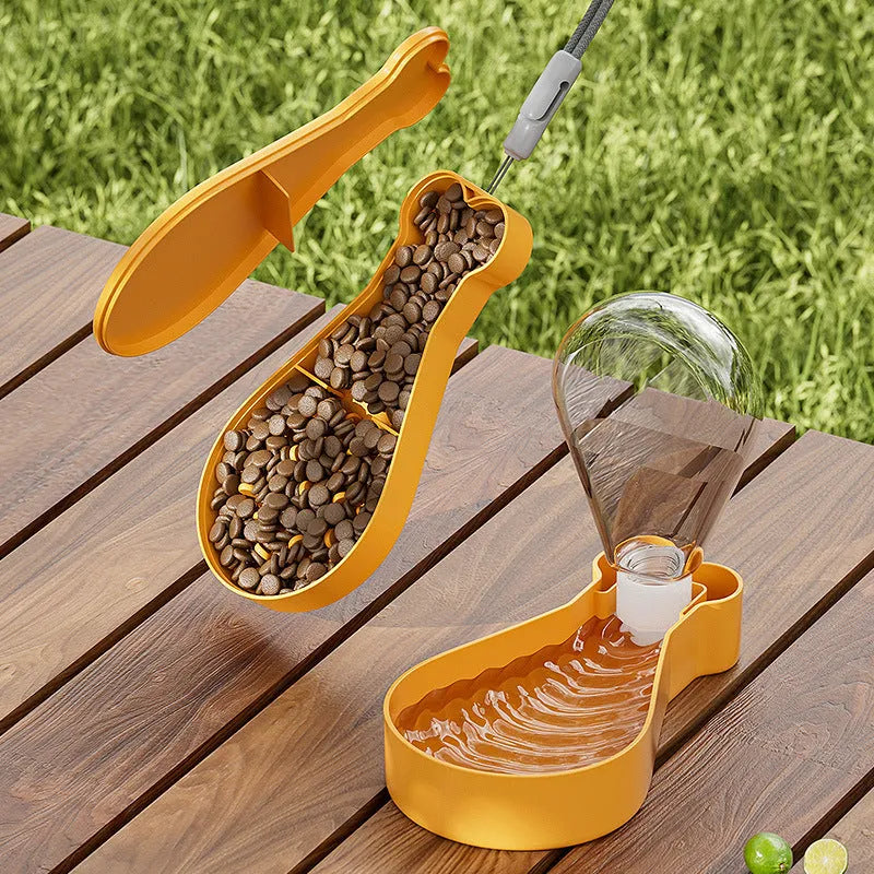 Orange and white portable pet water feeder with water bottle and treat container compartments