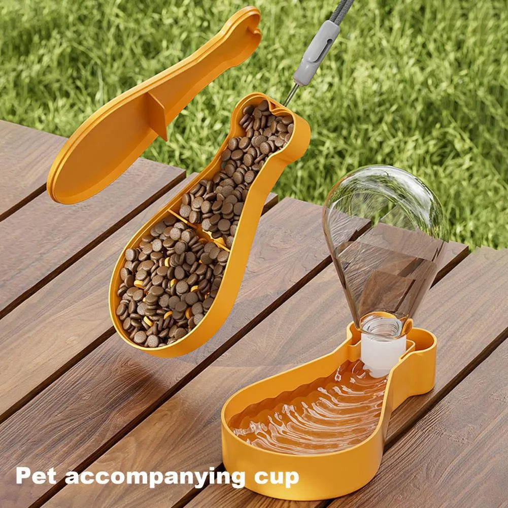 Orange and white portable pet water feeder with water bottle and treat container compartments
