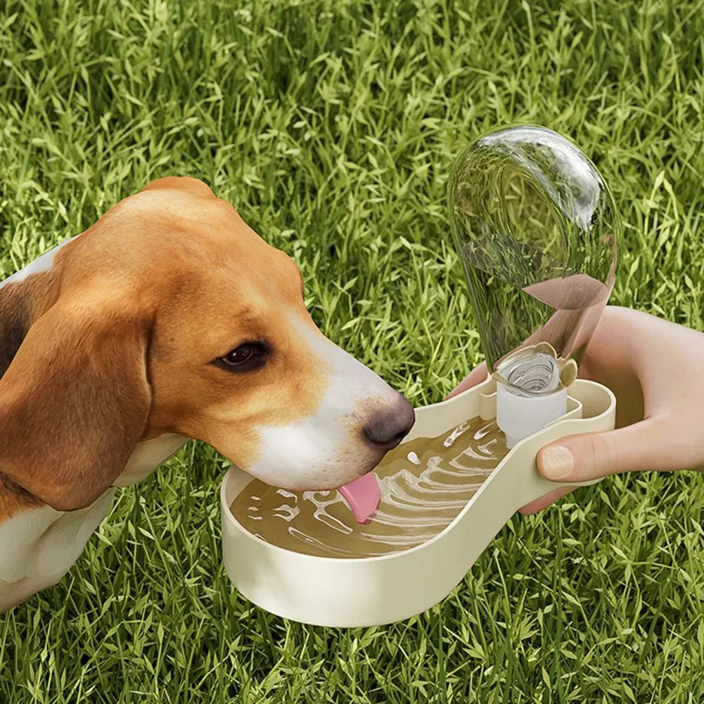 Orange and white portable pet water feeder with water bottle and treat container compartments