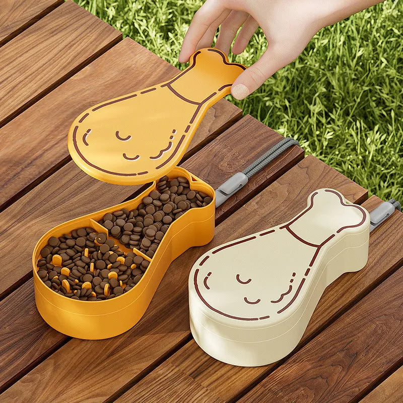 Orange and white portable pet water feeder with water bottle and treat container compartments