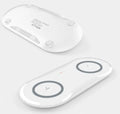 Dual wireless charging pad showing two phones charging simultaneously with black or white colour options