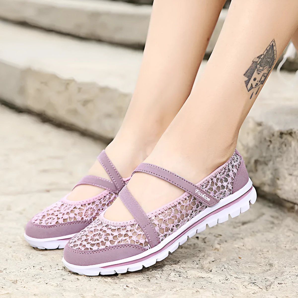 Women's casual flat shoe with breathable mesh upper in beige colour, showing round toe and flat heel design.
