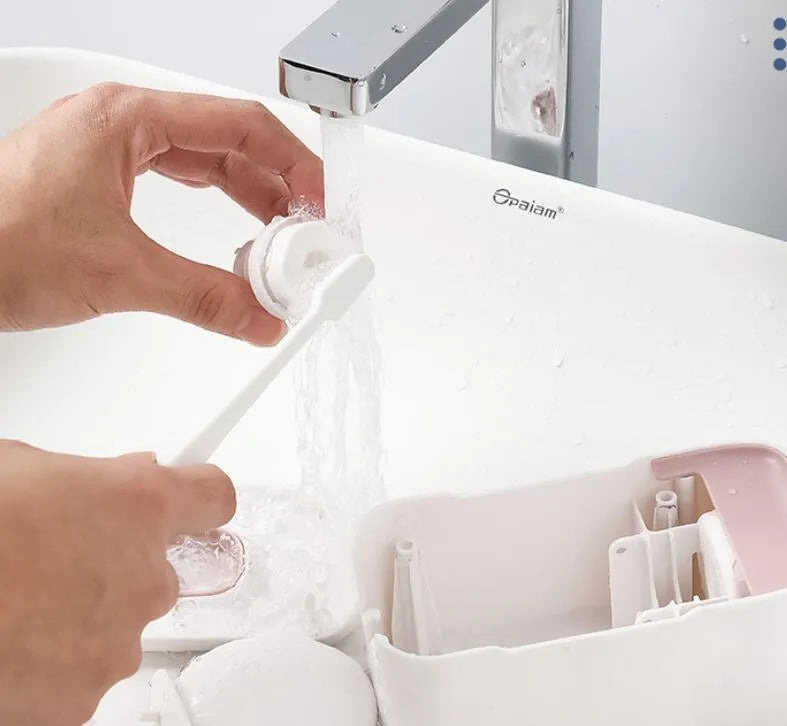 Automatic touchless toothpaste dispenser with digital LCD display mounted on a bathroom wall