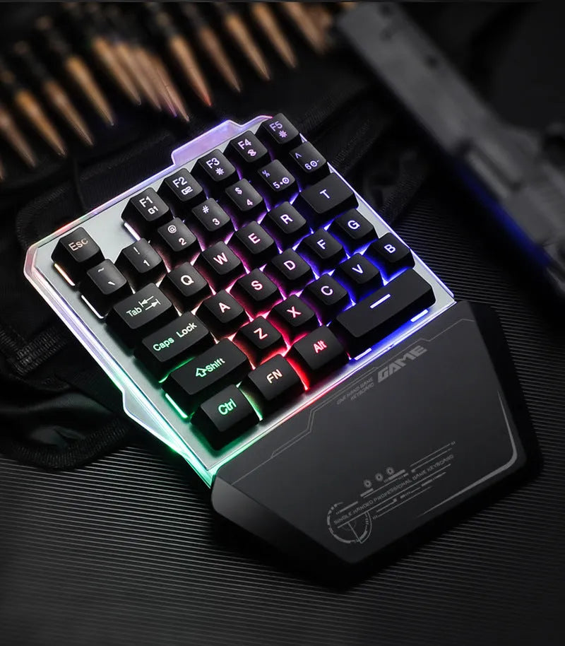 Black G40 one-handed mechanical gaming keyboard with RGB backlit keys on a desktop