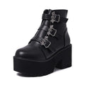 Black women's gothic punk Martin boots with a silver bat buckle and side zip.