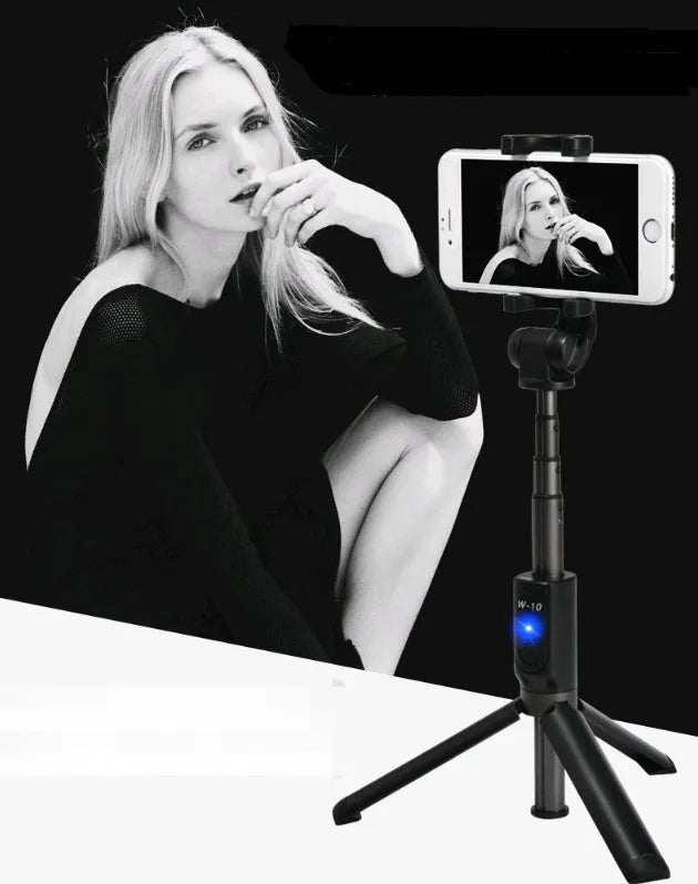 Black Bluetooth selfie stick with extended phone clamp and folded tripod legs