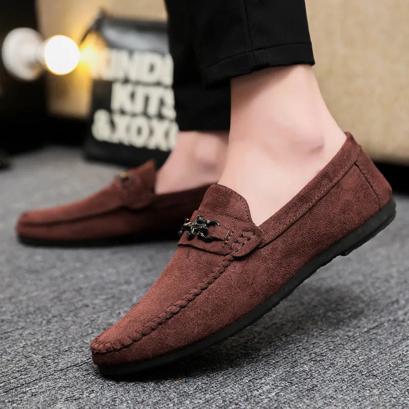 Men's waterproof black and brown slip-on loafers with round toe and low stiletto heel on a rubber sole.
