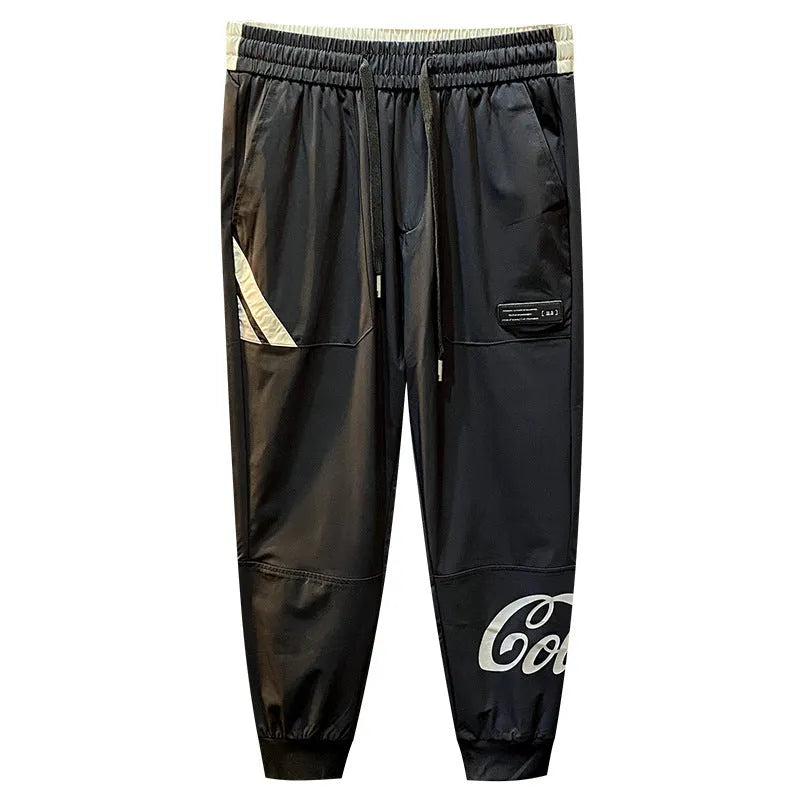 Black men's cropped casual trousers with ankle band, made from ultra-thin ice silk fabric.