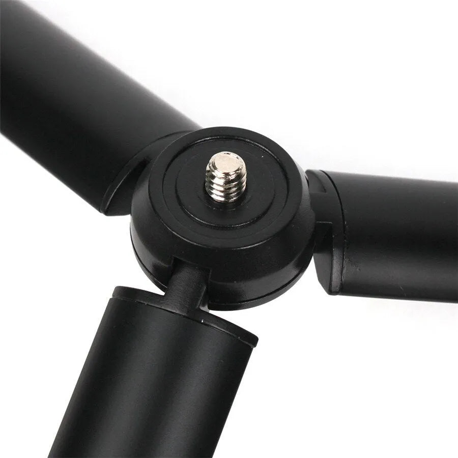 Black aluminium alloy mobile phone tripod with handheld stabiliser accessory compatible with Apple iPhone