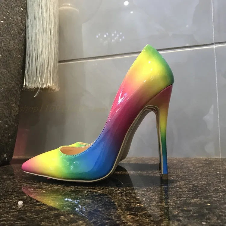 Rainbow patent leather pointed toe stiletto heels with thin ultra-high heel on white background