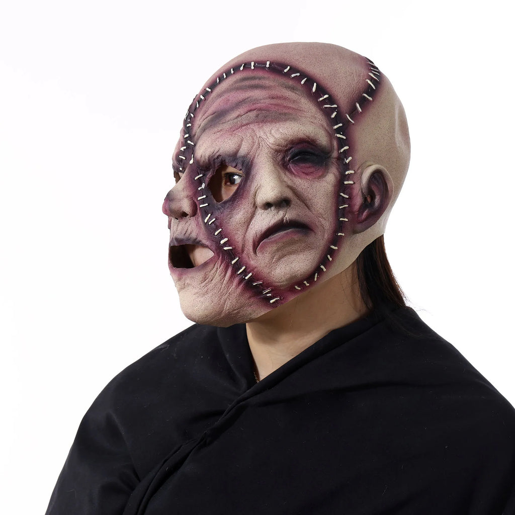 Latex three-sided Grimace horror Halloween mask for adults on a black background.