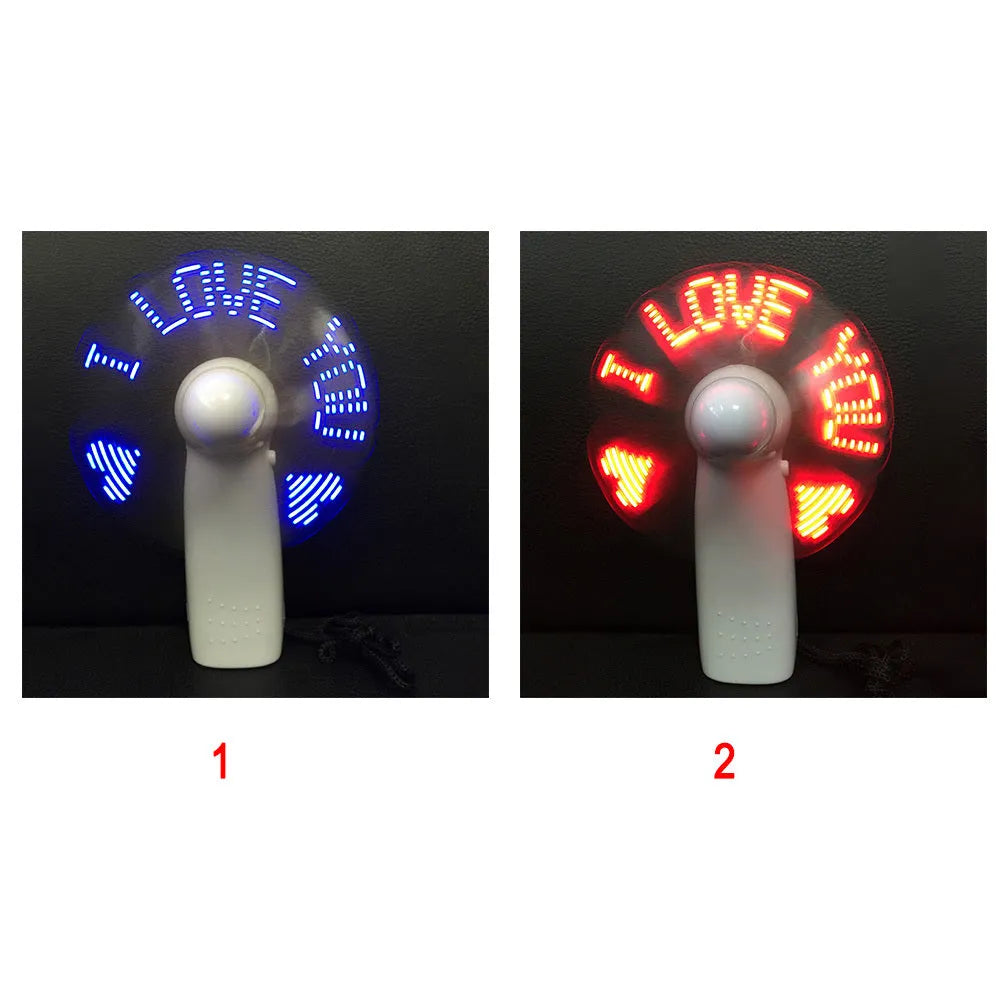 White handheld mini fan with flashing blue and red LED 'I Love You' pattern display