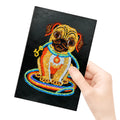 Black A5 diamond painting notebook with elastic closure showing open pages for craft organisation