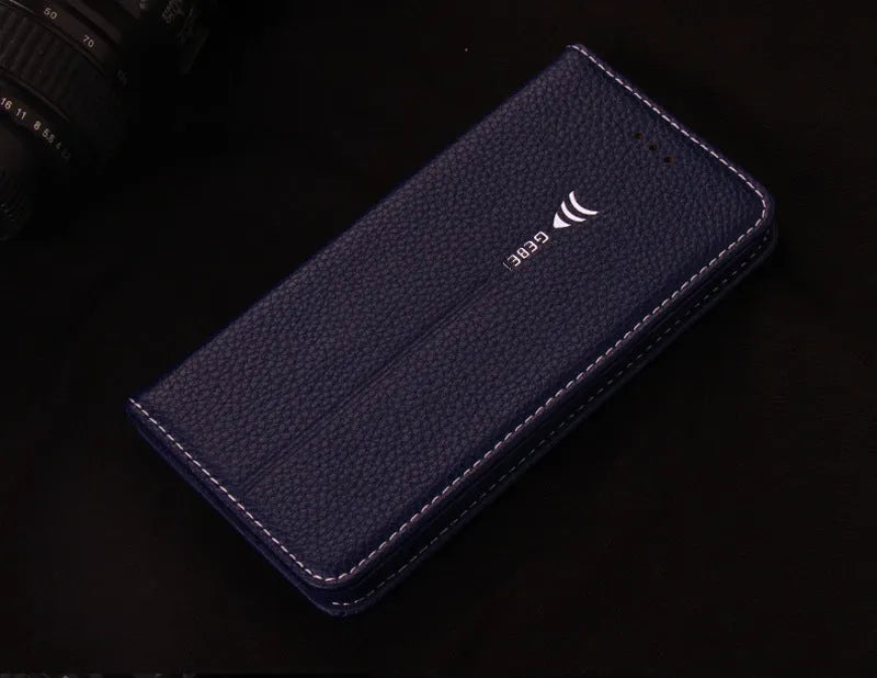 Black PU leather wallet phone case open showing card slot, next to an iPhone.