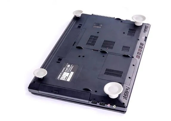 Two large and two small grey plastic laptop cooling pads on a flat surface.