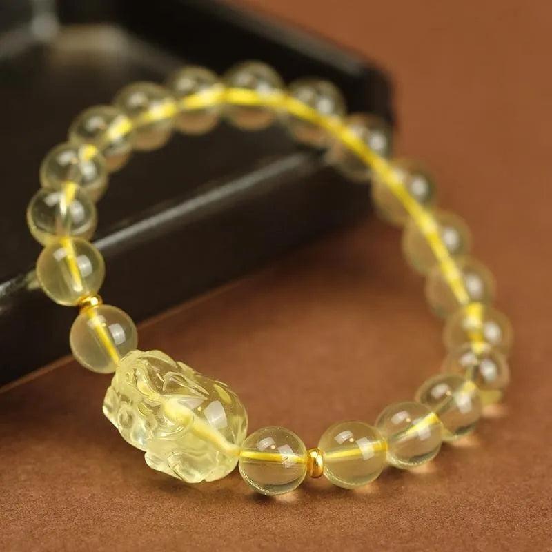 Yellow leather citrine pi xiu bracelet with artificial crystal beads and adjustable leather cord fastening