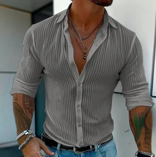 Man wearing a British-style striped cardigan with long sleeves and a loose fit