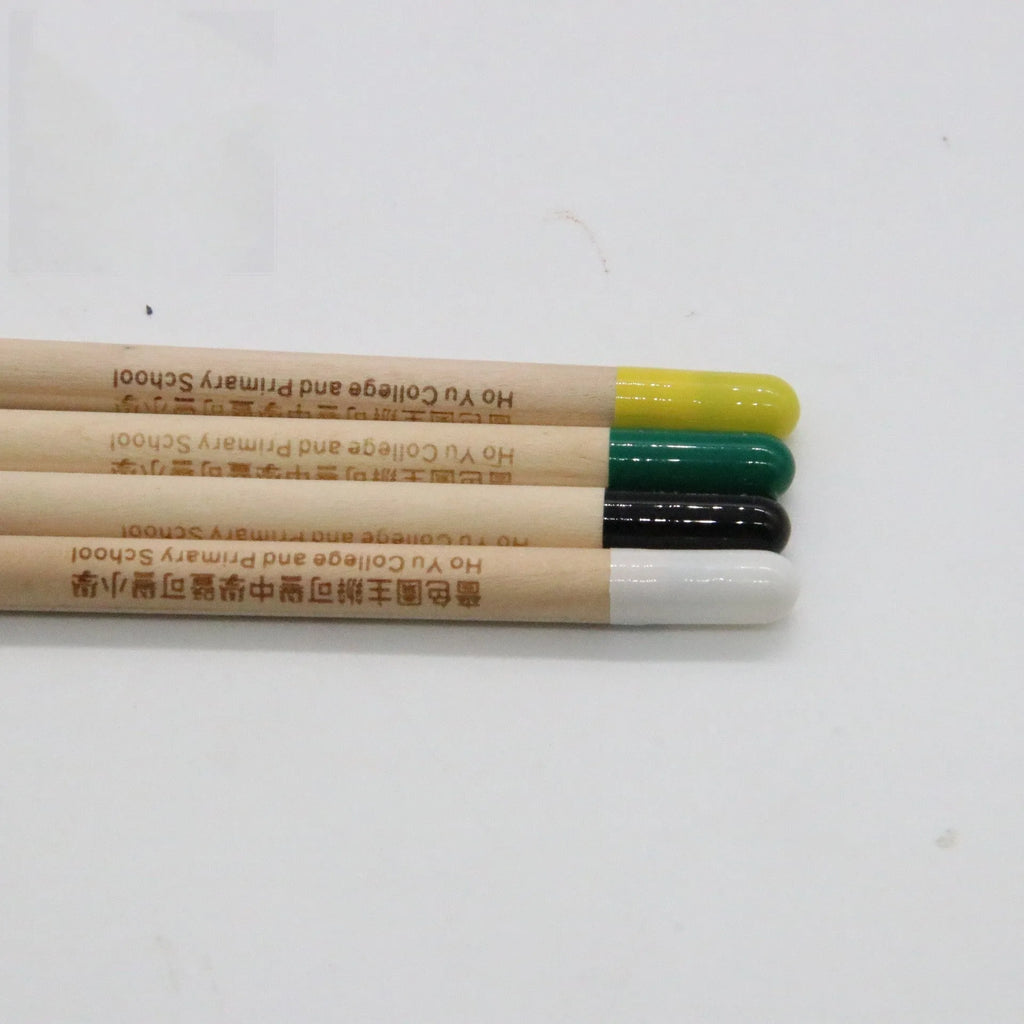 HB Seed Pencil with coloured degradable capsule containing plantable seeds on a soil background.