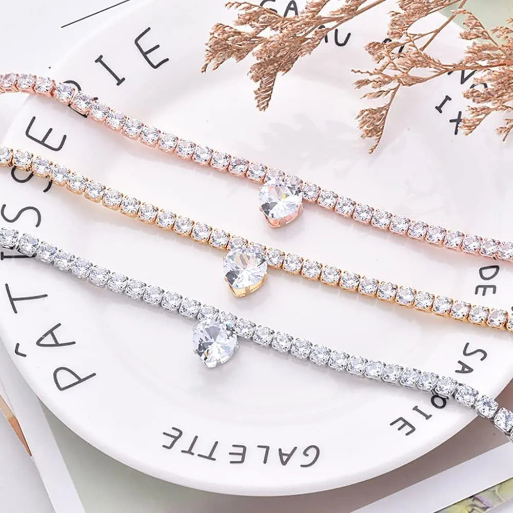 Gold heart-shaped rhinestone dog collar with bling crystals and adjustable extension chain