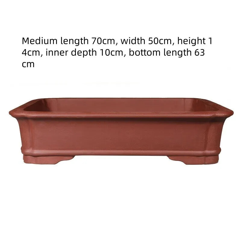 Large rectangular handmade purple clay flowerpot showing its thickened walls and natural finish.
