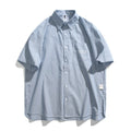 Blue and white striped loose-fitting short sleeve shirt cardigan style on hanger
