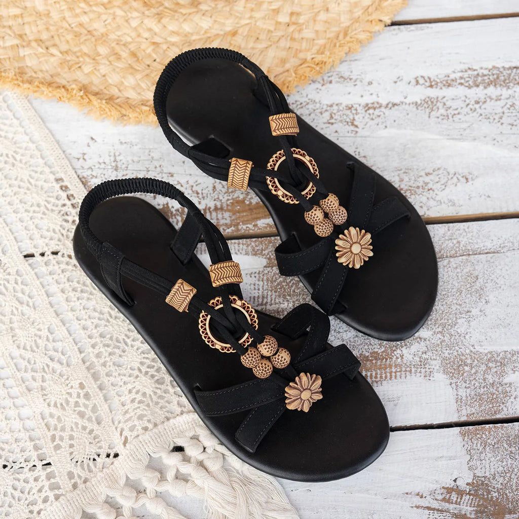 Black ethnic style women's sandals with beaded weave detailing and elastic band wearing method