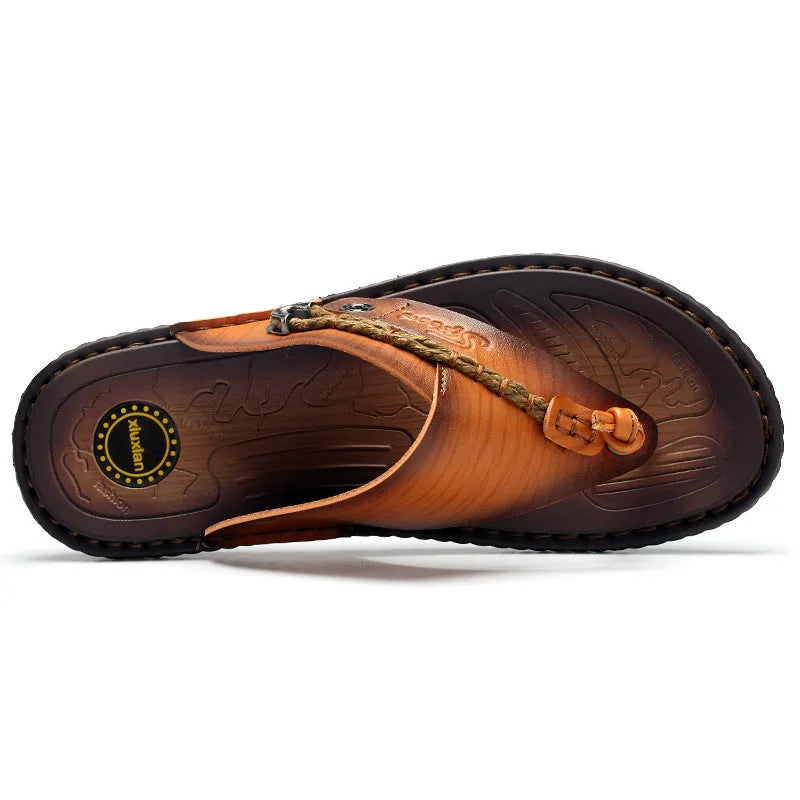 Men's dark blue herringbone-patterned outdoor slippers with a leather lining and rubber sole, shown in a large size.