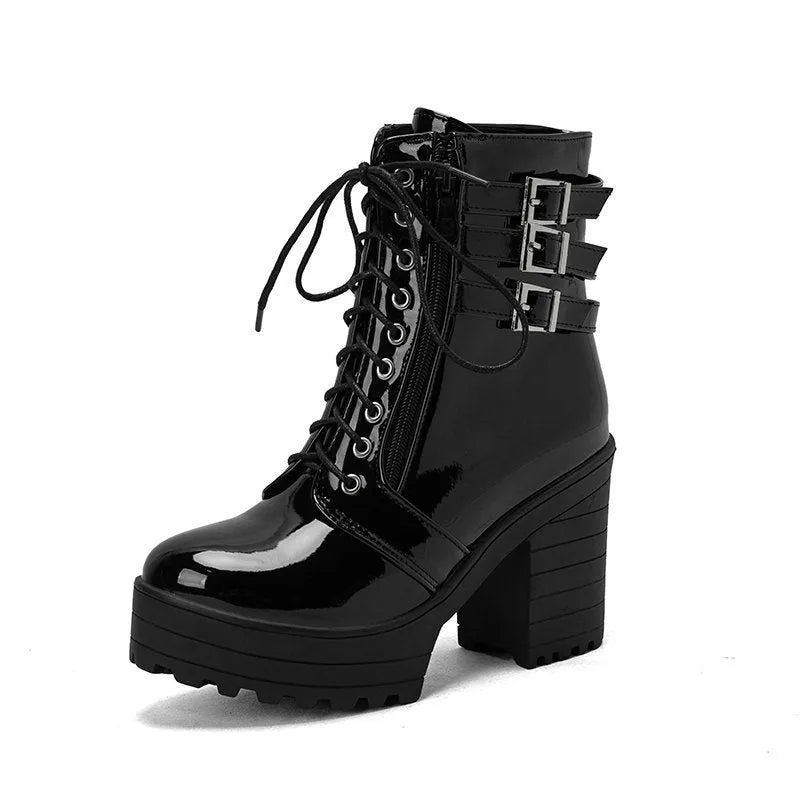Women's black thick-heeled short boots with lace-up front and waterproof platform on a rubber sole.