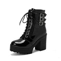 Women's black thick-heeled short boots with lace-up front and waterproof platform on a rubber sole.