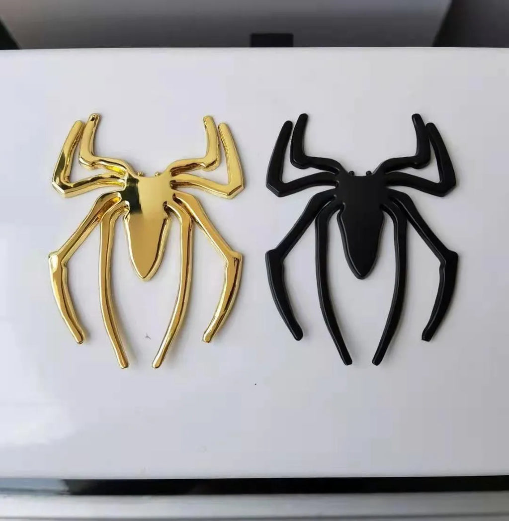 Three-dimensional zinc alloy spider bumper sticker in gold colour measuring 7cm by 5cm